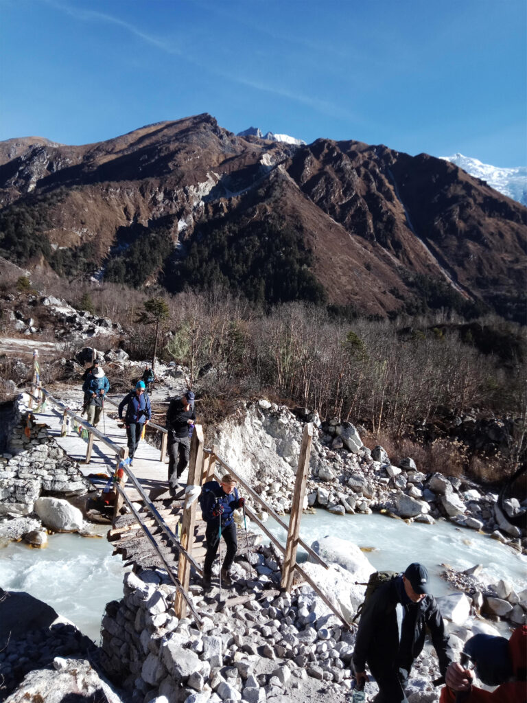 Crossing a suspension bridge over Punkar River and heading toward Dharapani