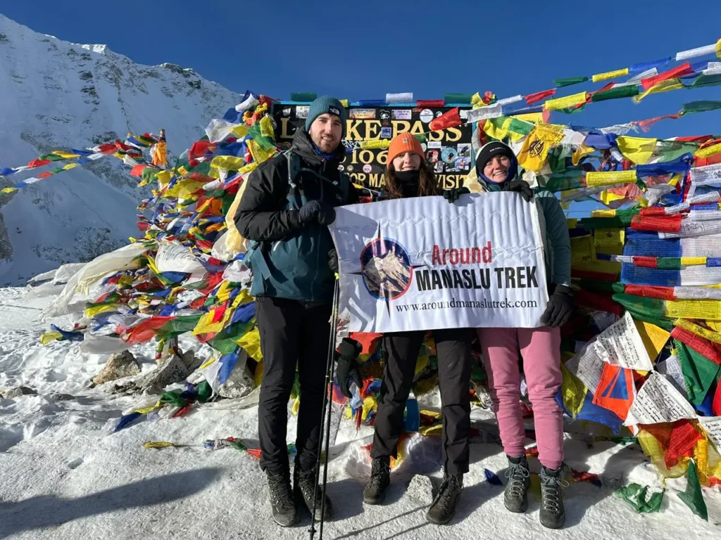 Manaslu Circuit Trek - 15 Days 3 At the Larke Pass with the banner of Around Manaslu Trek